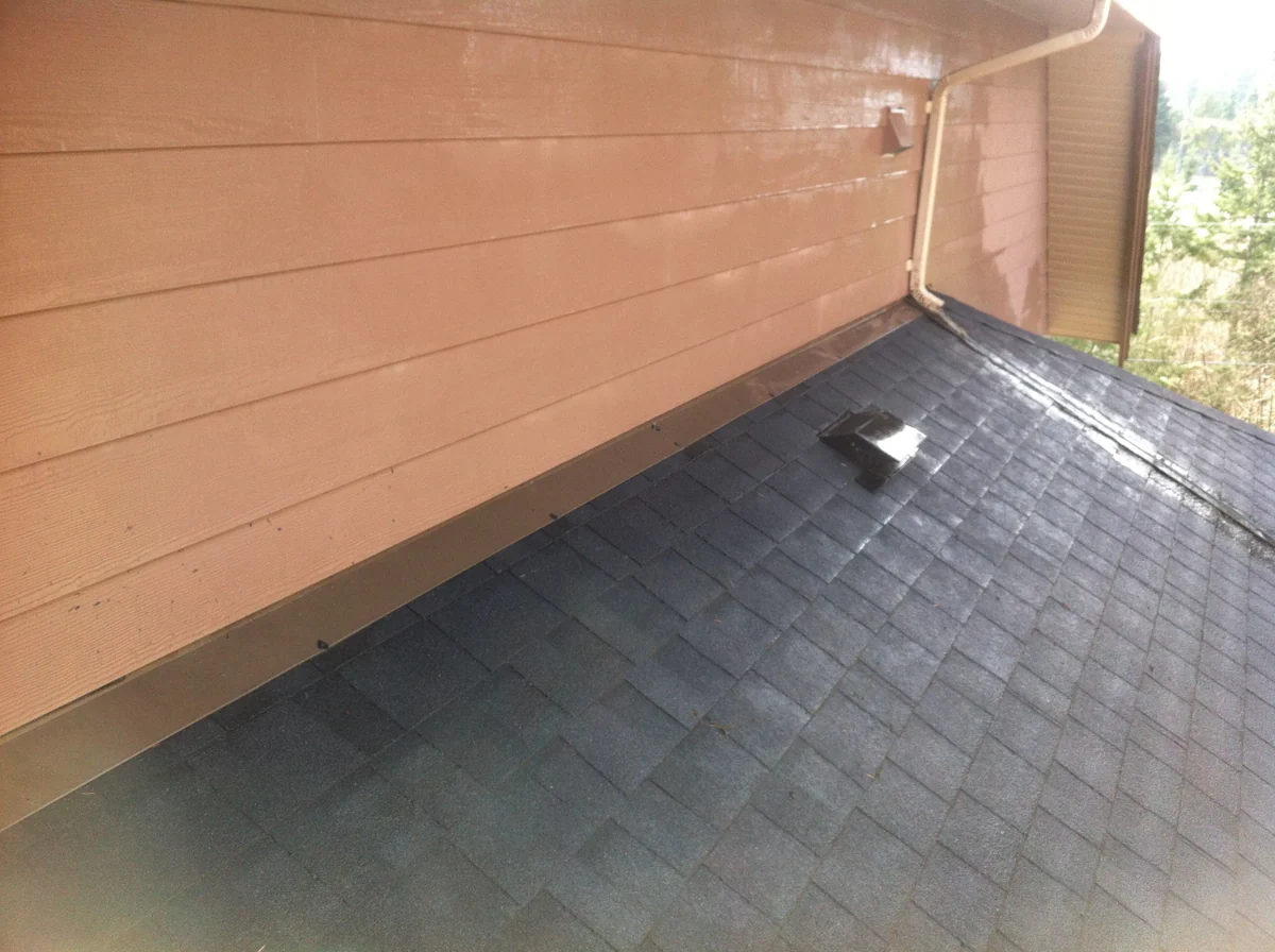 Roof detail where shingles meet a wall